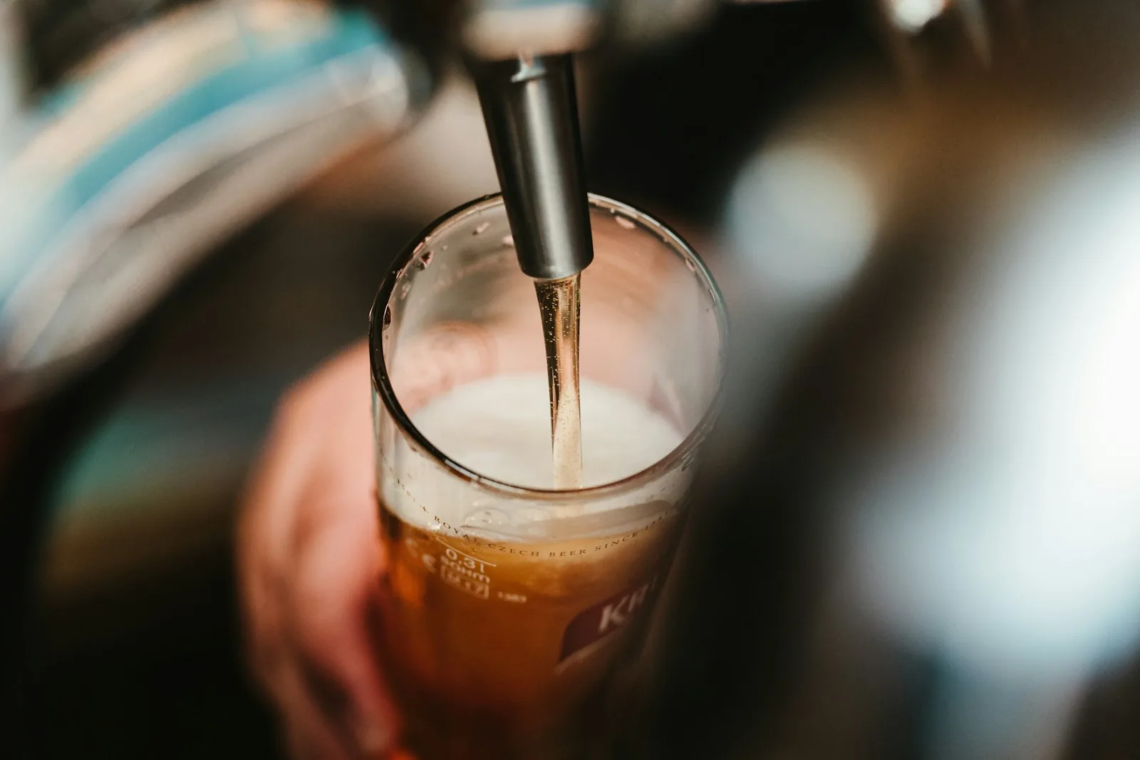 Craft beer being poured from a tap